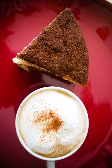 Triangle shaped cake slice and cappuccino